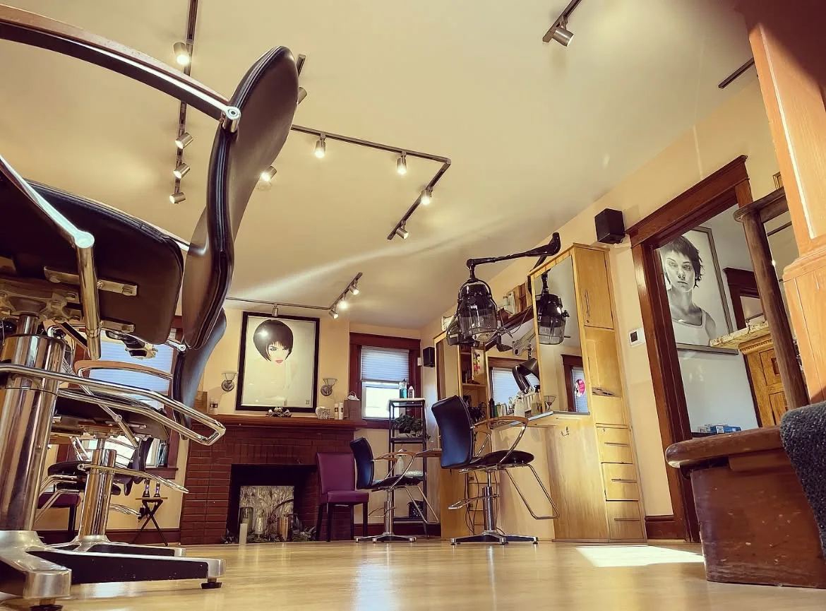 Styling stations and fireplace inside Shortino's hair salon in York, Pennsylvania